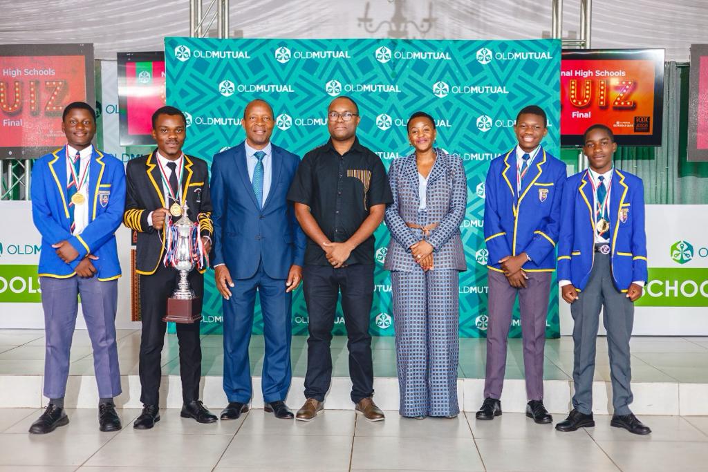 The winning Marist Brothers High School team poses with Old Mutual Zimbabwe Group Chief Operations Officer, Isiah Mashinya (third from left) and Primary and Secondary education deputy minister Angeline Gata (fifth)